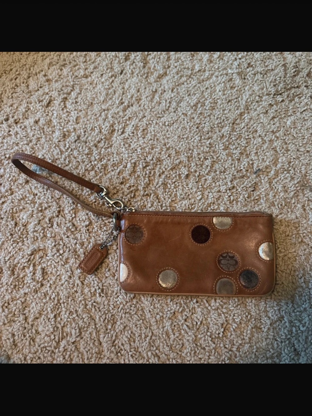 Coach Tan Leather Wristlet with Metallic and Dark Circle Accents